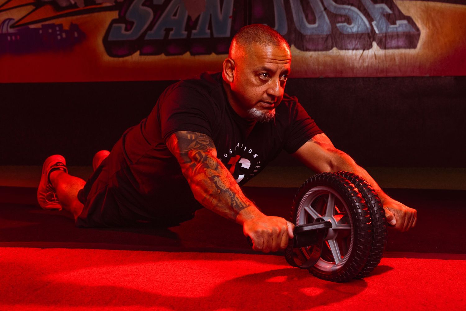 A sequence of car wheel repair and maintenance shots shown in red lighting at an auto shop.
