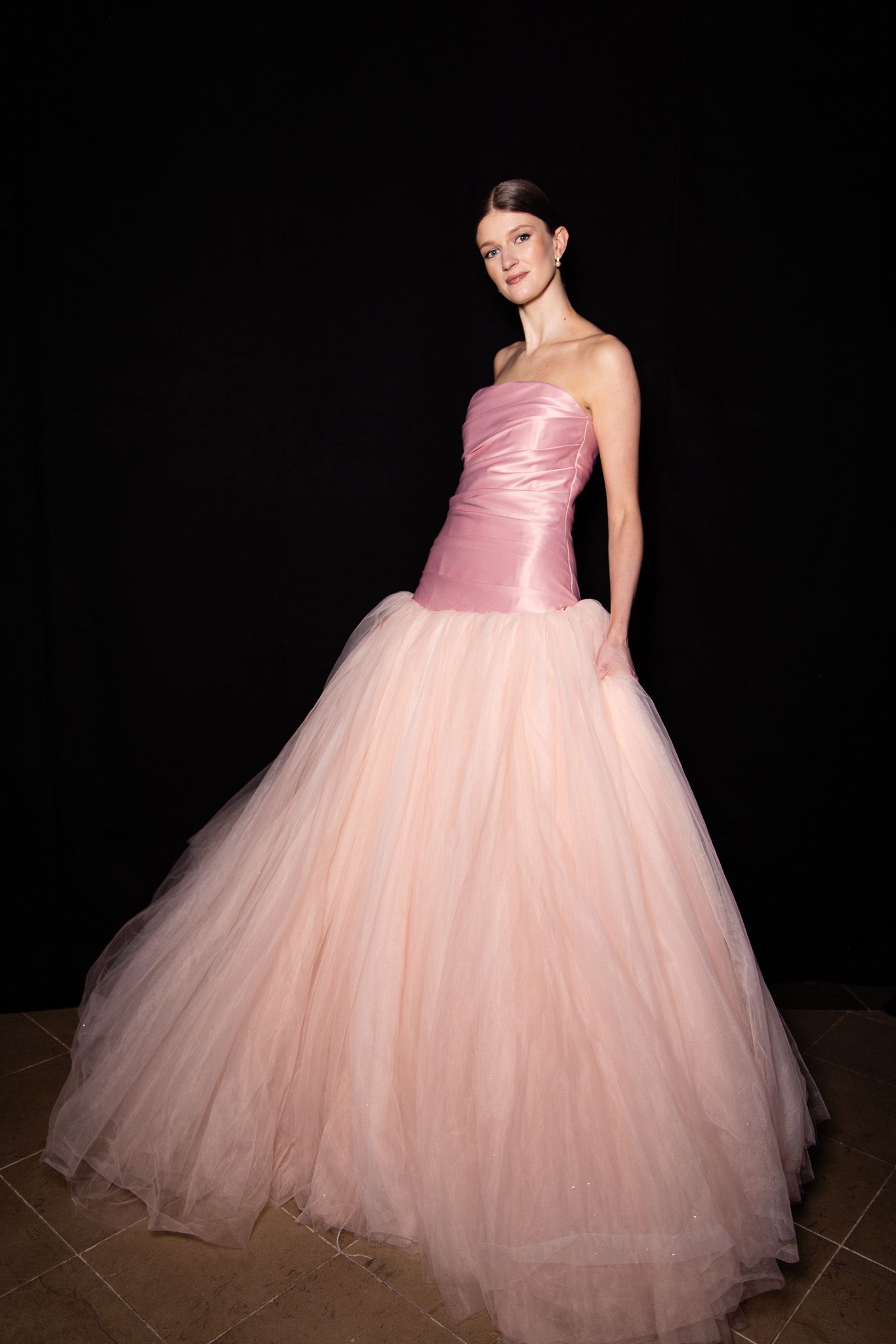 Pink princess ball gown with satin bodice and tulle skirt shown from multiple angles on dark background.