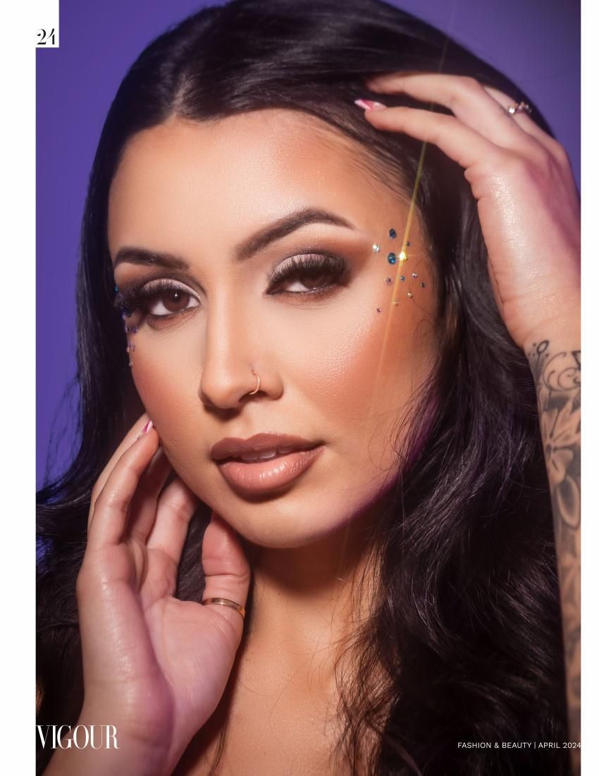 Beauty portrait with purple backdrop featuring glamorous makeup and jewelry styling.
