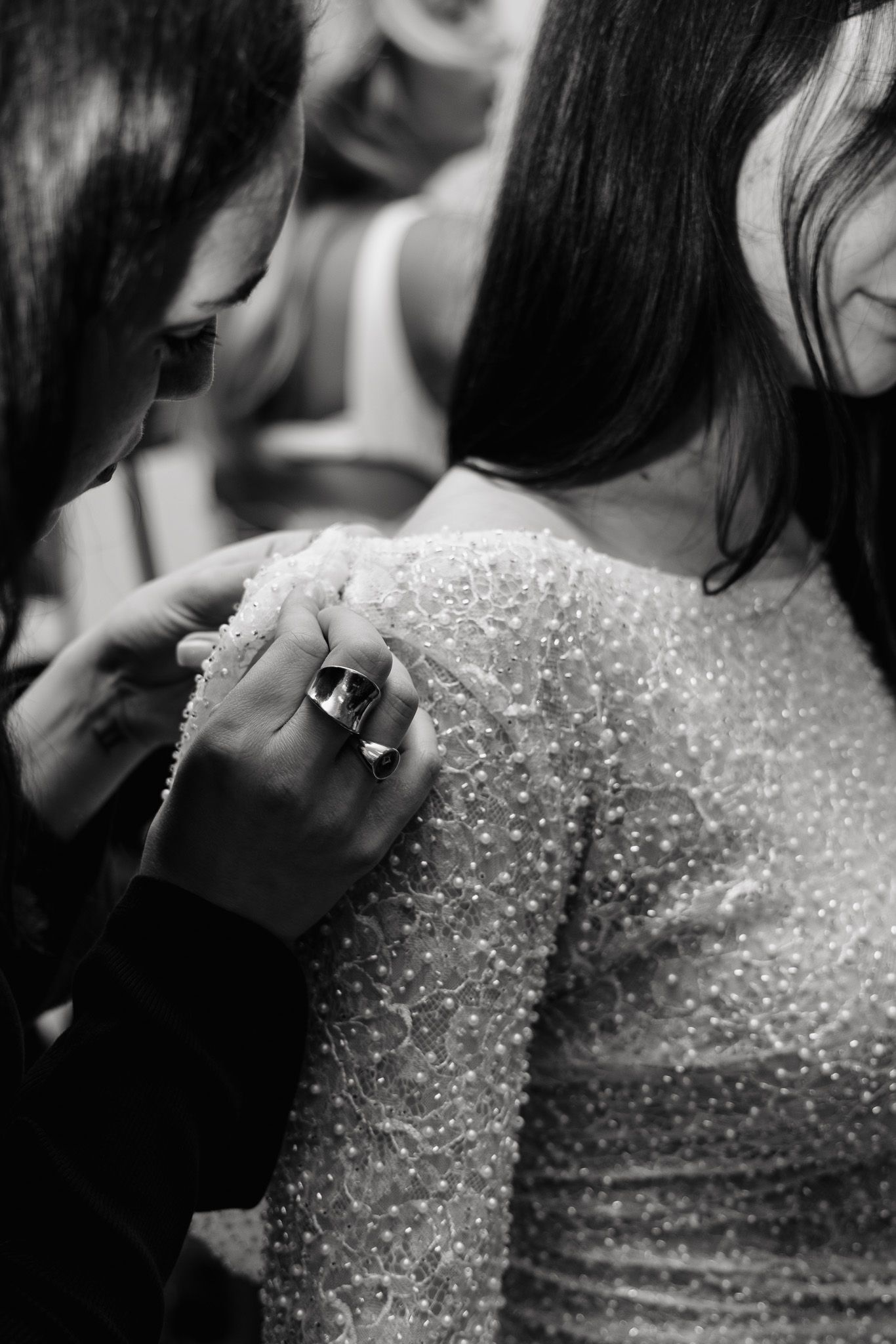 Sparkly beaded evening dress detail captured in black and white photography.