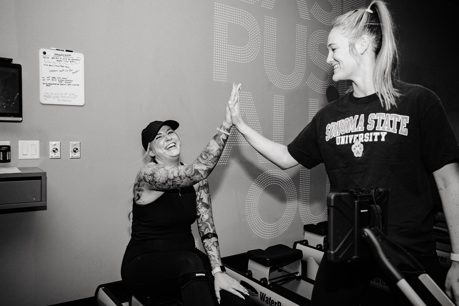 Black and white photos show performers and participants engaging in an improv comedy workshop with dramatic gestures.