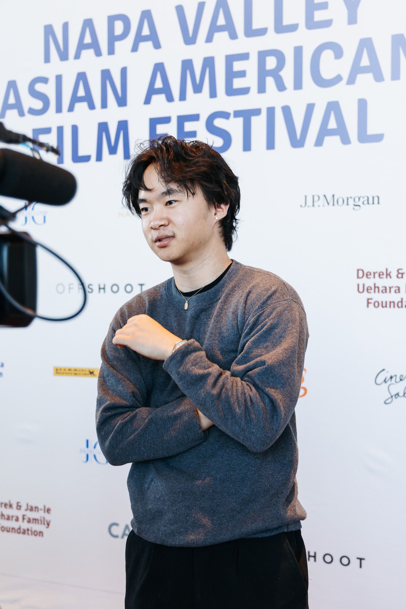 Event backdrop showing Napa Valley Asian American Film Festival branding and sponsor logos.