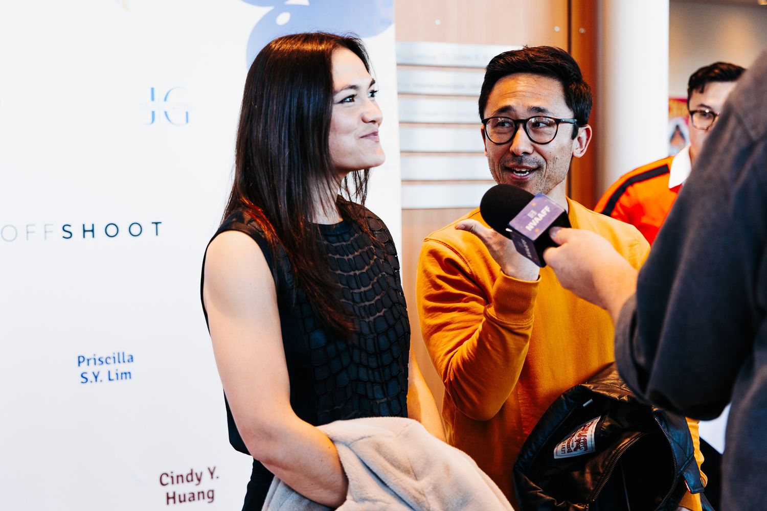 Two people engaged in conversation at a film festival event.