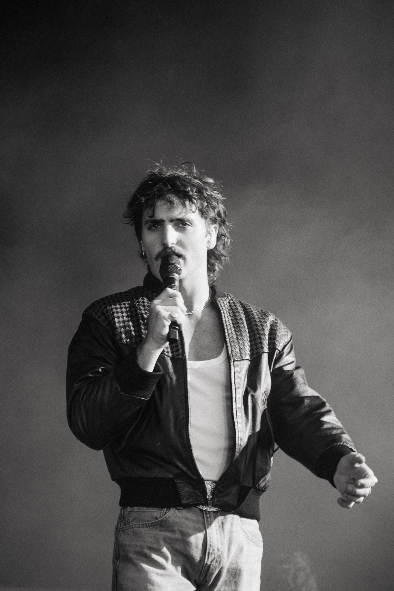 Black and white portrait series showing dynamic stage performance movements.