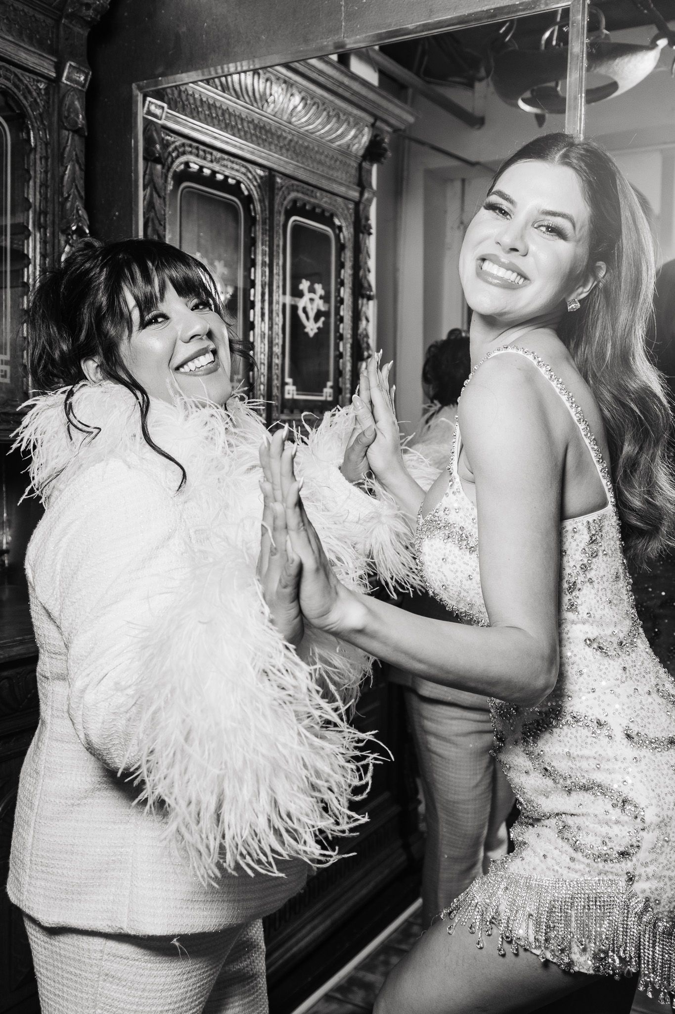 A series of glamour shots showing a white feathered dress with playful poses against a dark background.