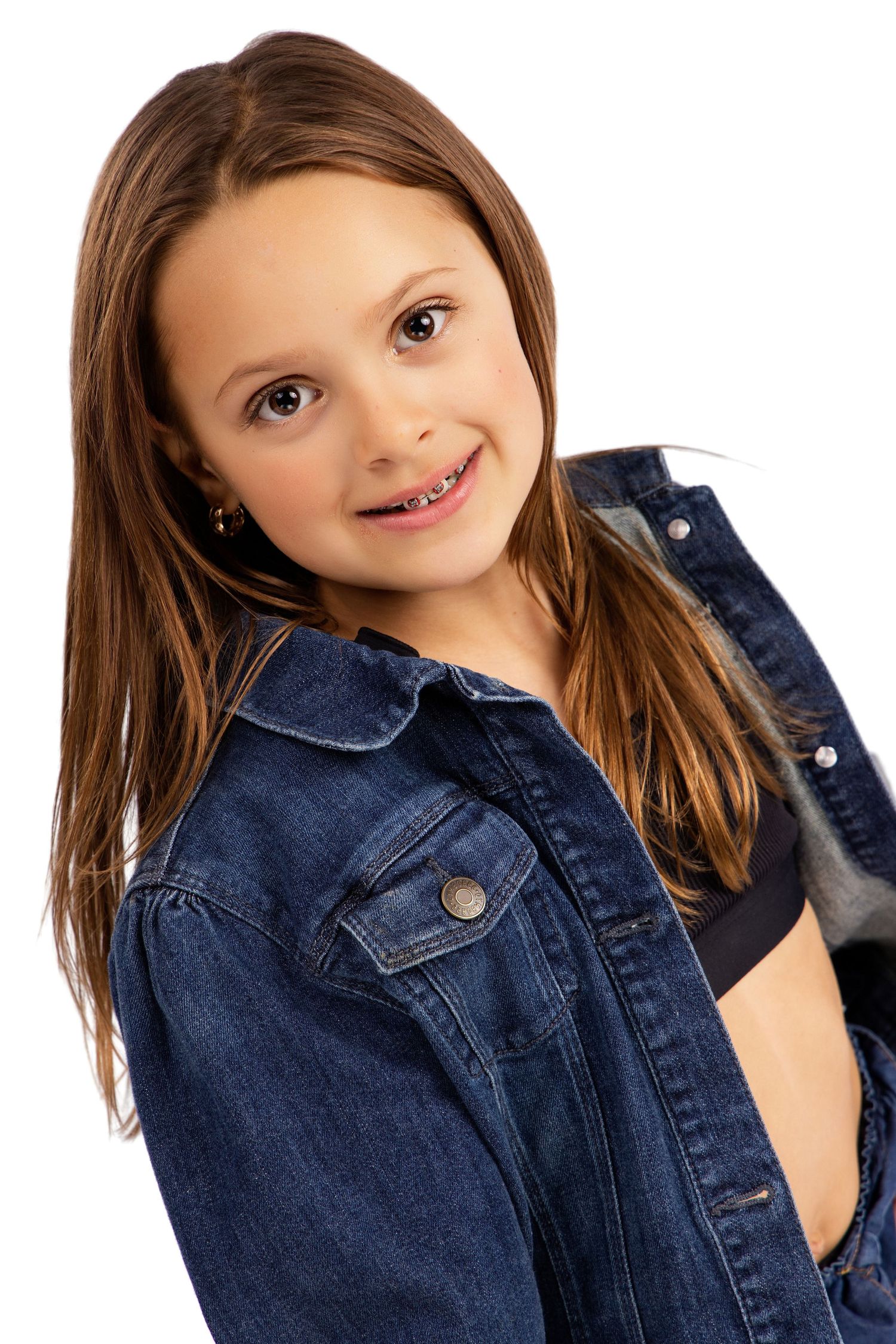 Young model wearing denim jacket poses playfully against white backdrop in multiple shots.