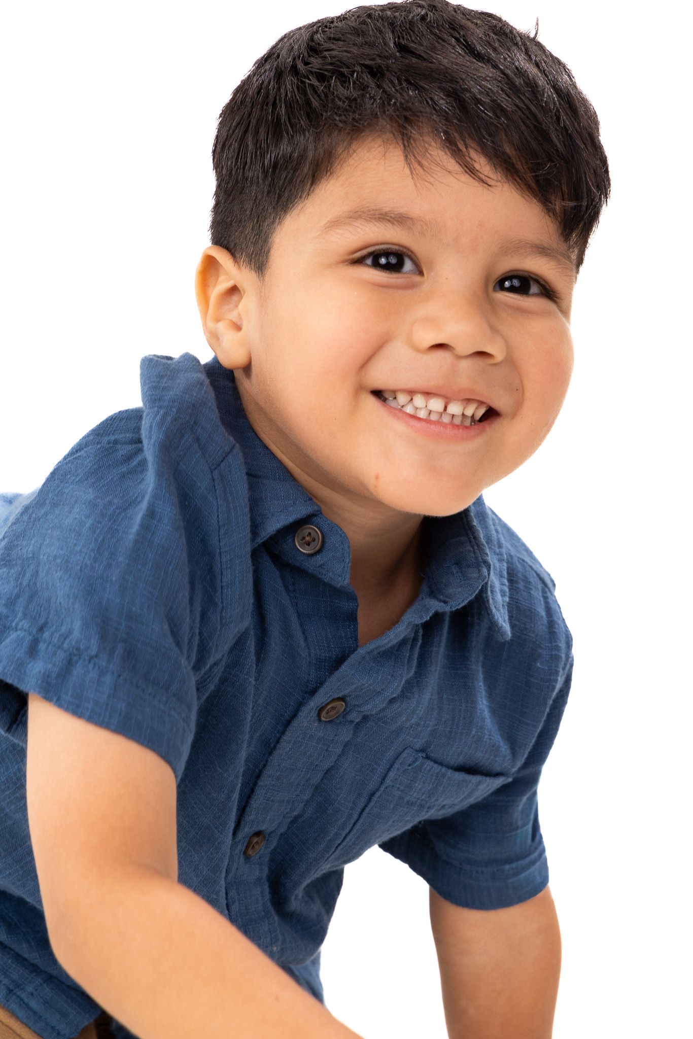 A series of playful poses showing a child in a blue polo shirt against a white background.