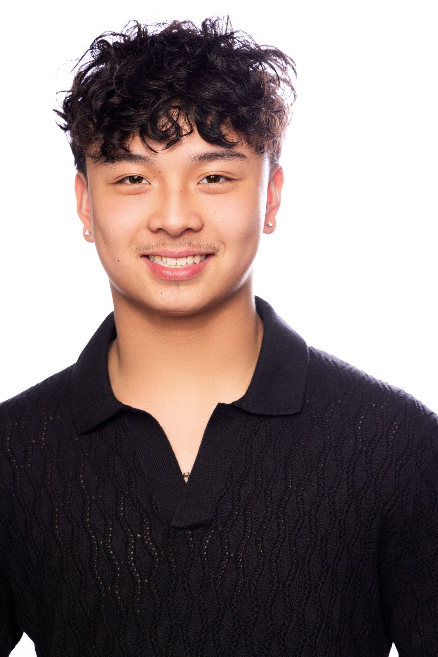 A series of four similar photos showing someone in a black sweater with curly hair against a white background.