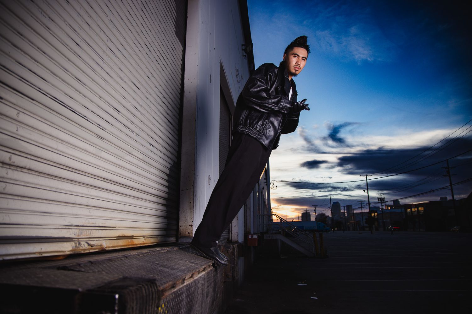 A series of dramatic skateboarding action shots captured at sunset against an urban backdrop with rolling garage doors.
