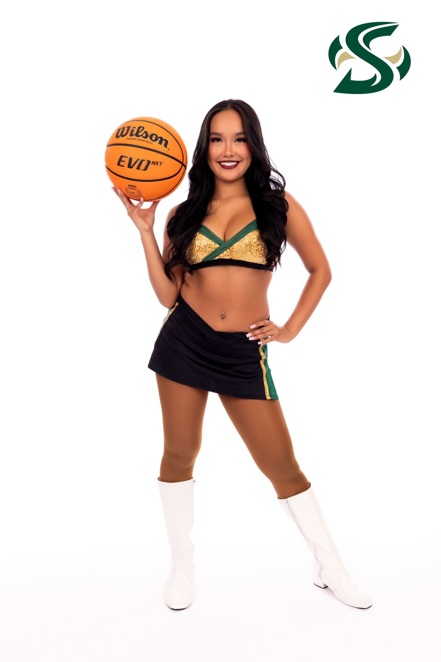 Sacramento Kings cheerleaders in green and black uniforms pose with basketballs in series of energetic performance poses.