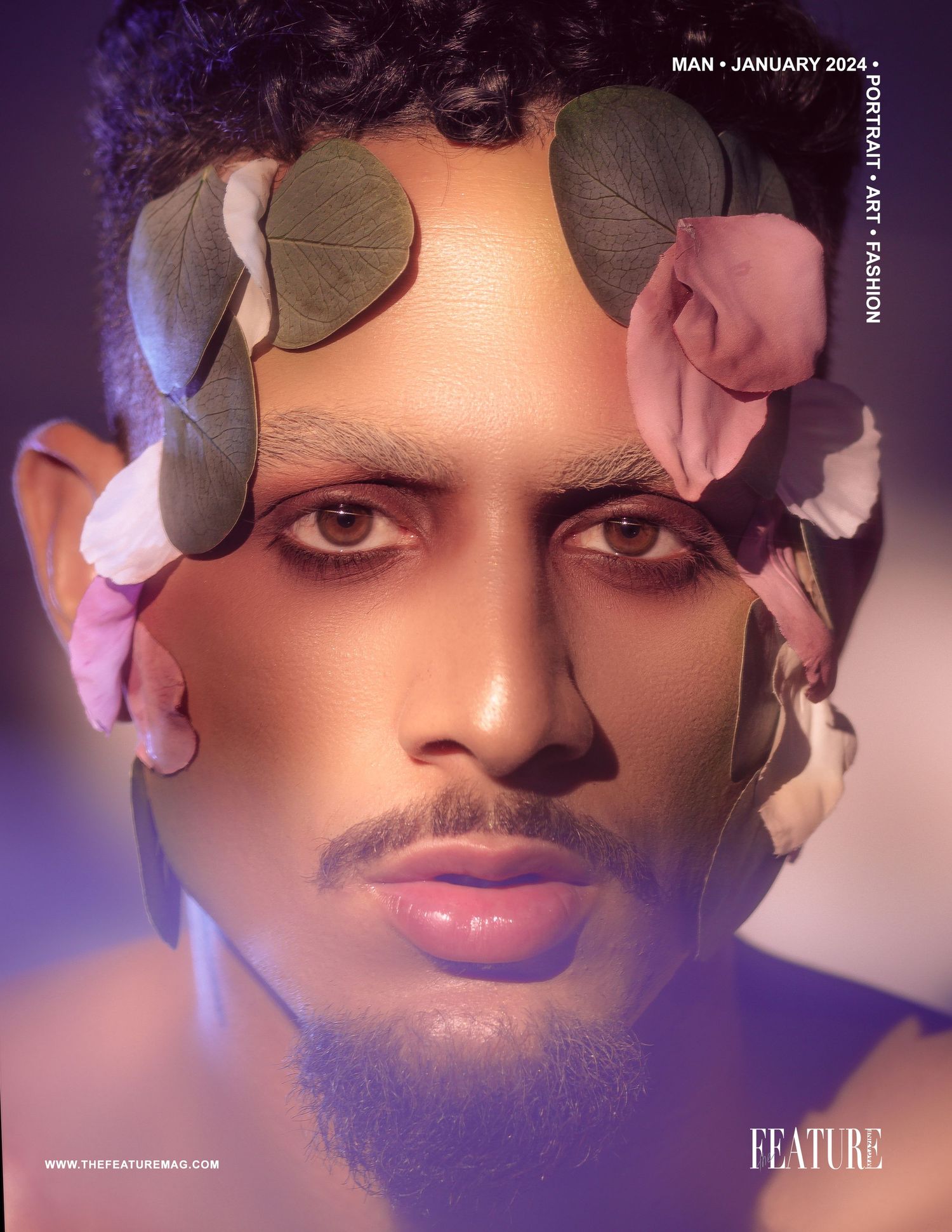 Artistic portrait with delicate floral elements framing the subject's face in soft lighting.