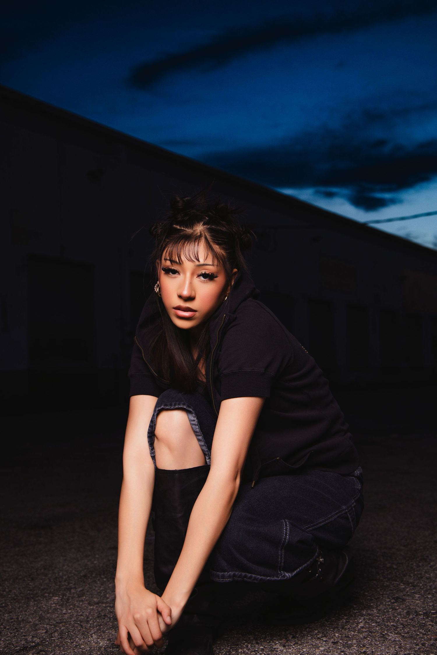 Artistic nighttime portrait series of someone in black clothing against dark background creating moody dramatic atmosphere.