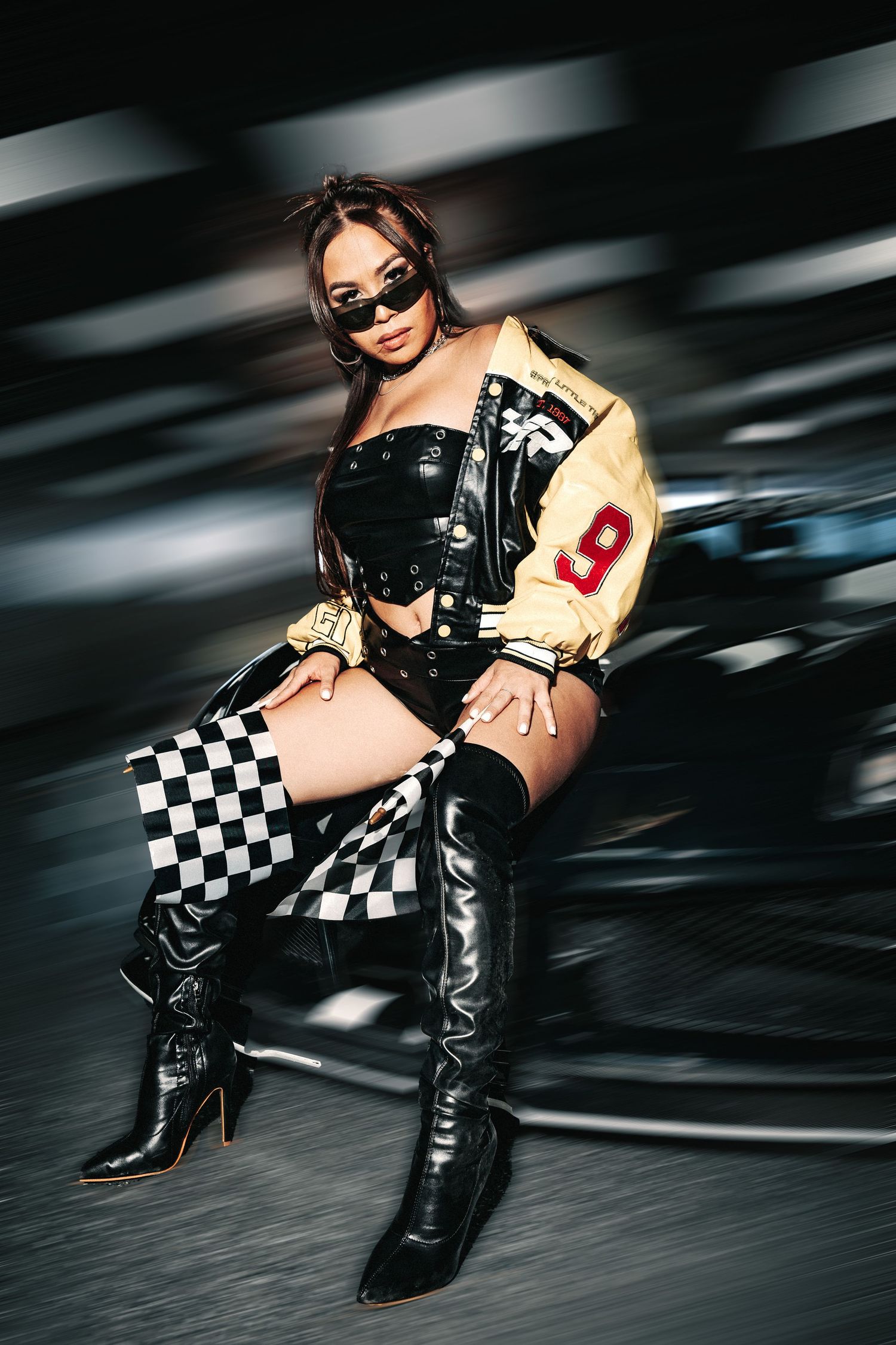 Stylized racing-themed fashion photo series showing boots, checkered flag, and motion blur effects in black and white tones.