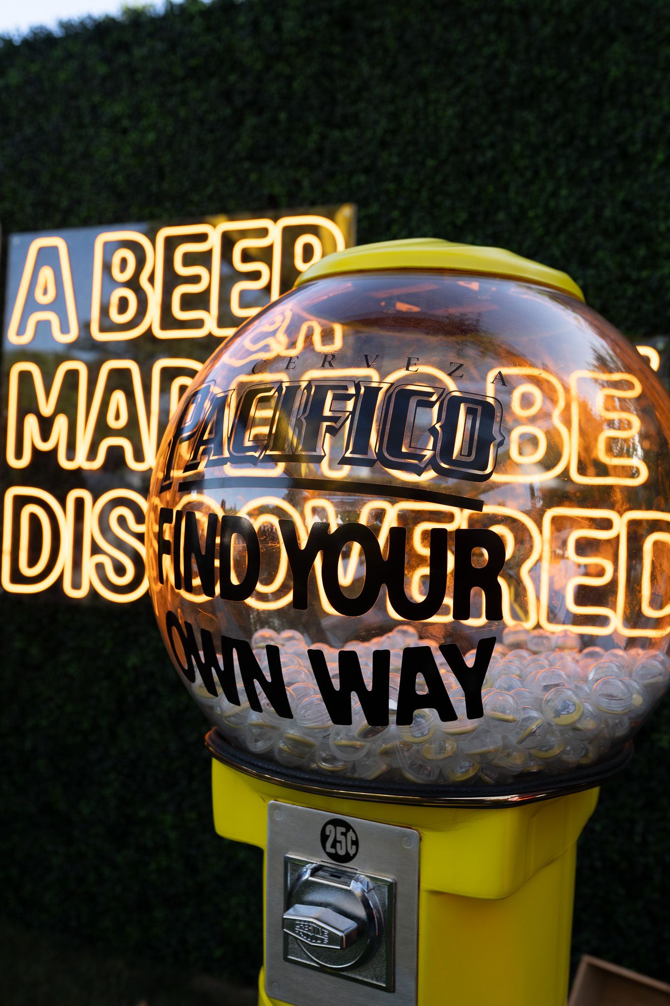 A series of vintage yellow parking meters with illuminated displays showing text and numbers.