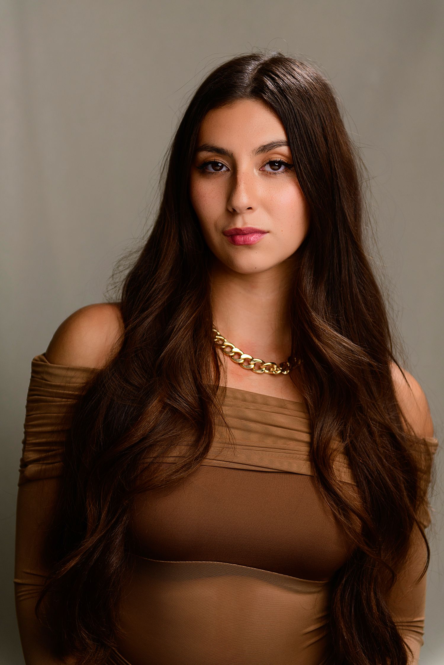Studio portrait with brown hair and tan top showing different poses against neutral background.