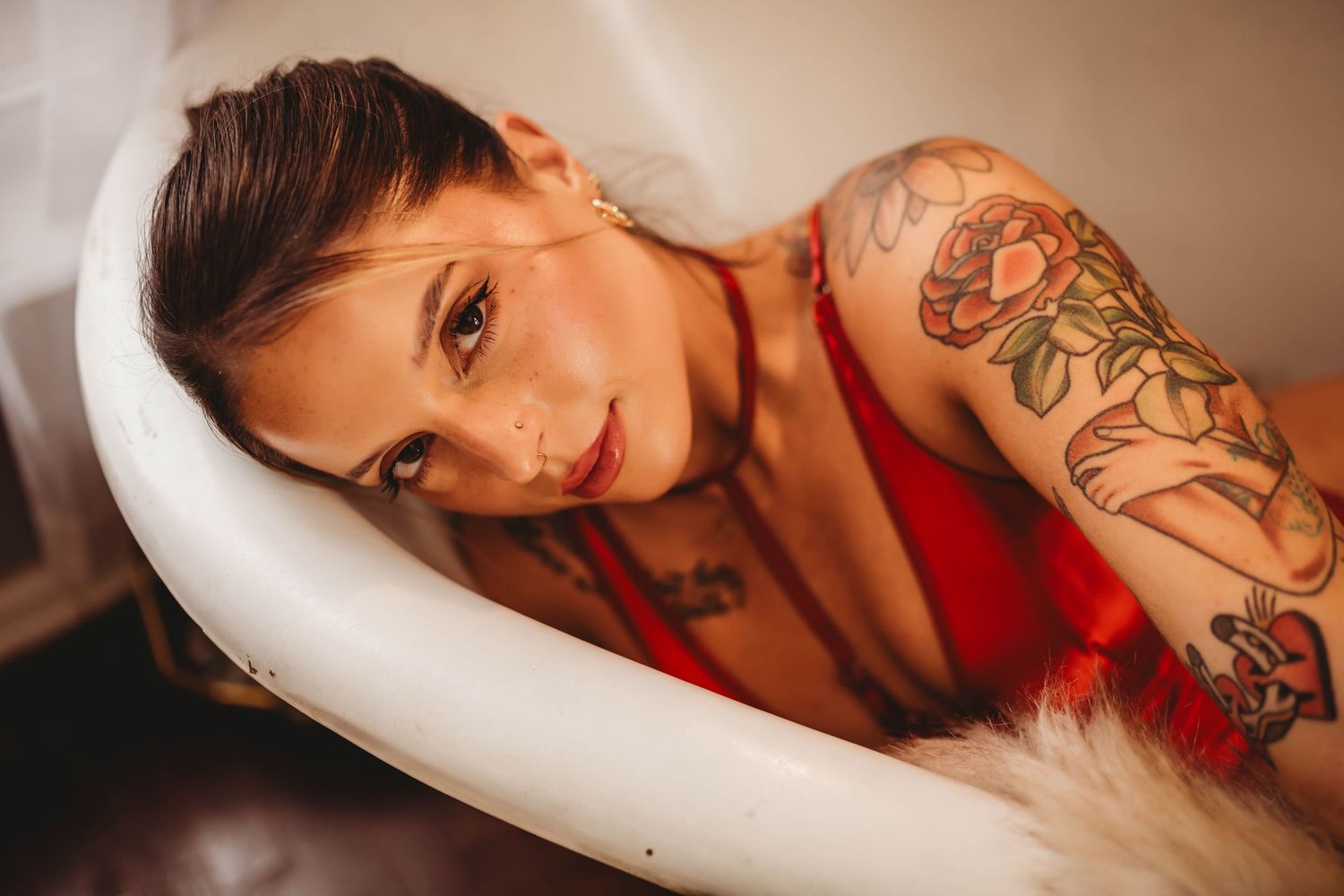 A photoshoot series shows someone in a red outfit posing in dramatic lighting against a neutral background.