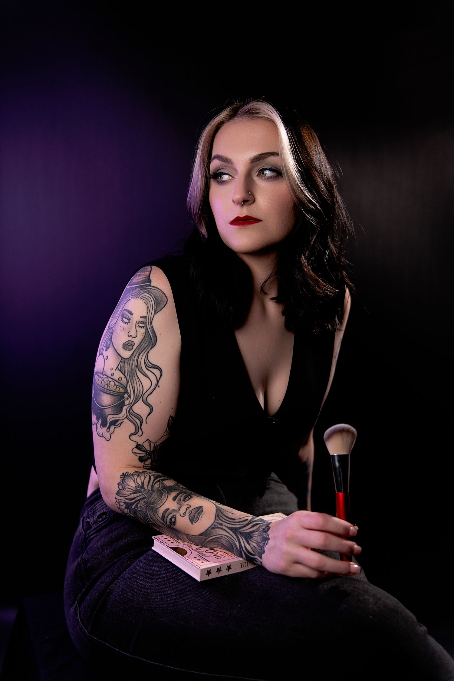 Dark moody portraits featuring tattoo sleeve art and gothic aesthetic against black background with purple lighting.