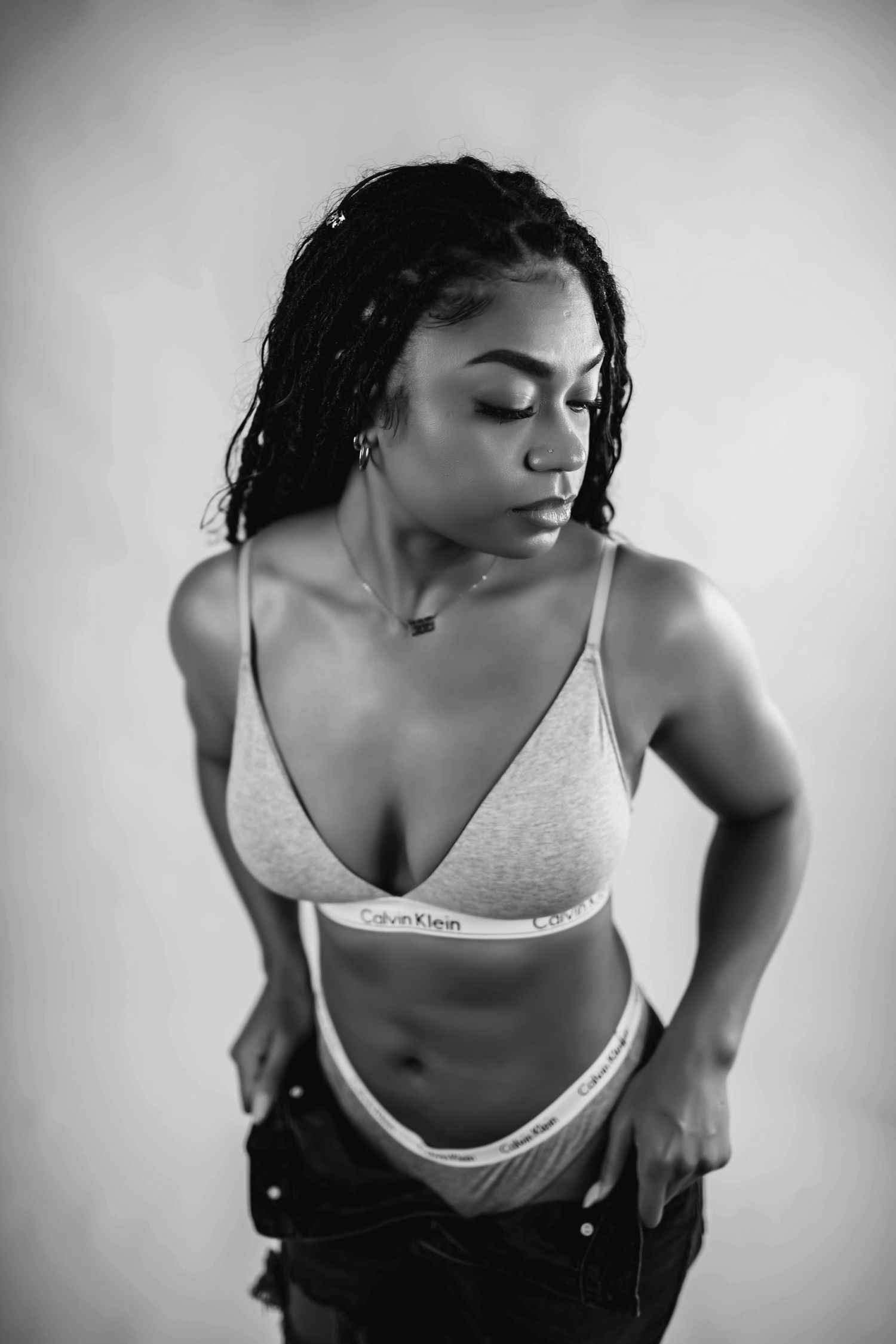 Black and white portrait series in athletic wear with dynamic poses.