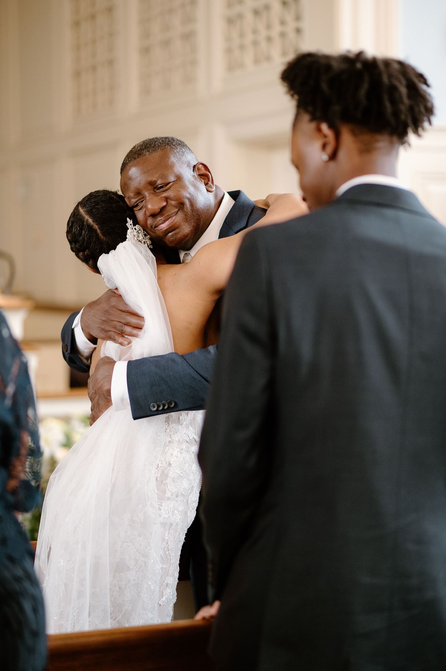 A tender wedding moment captured between a couple during their ceremony.