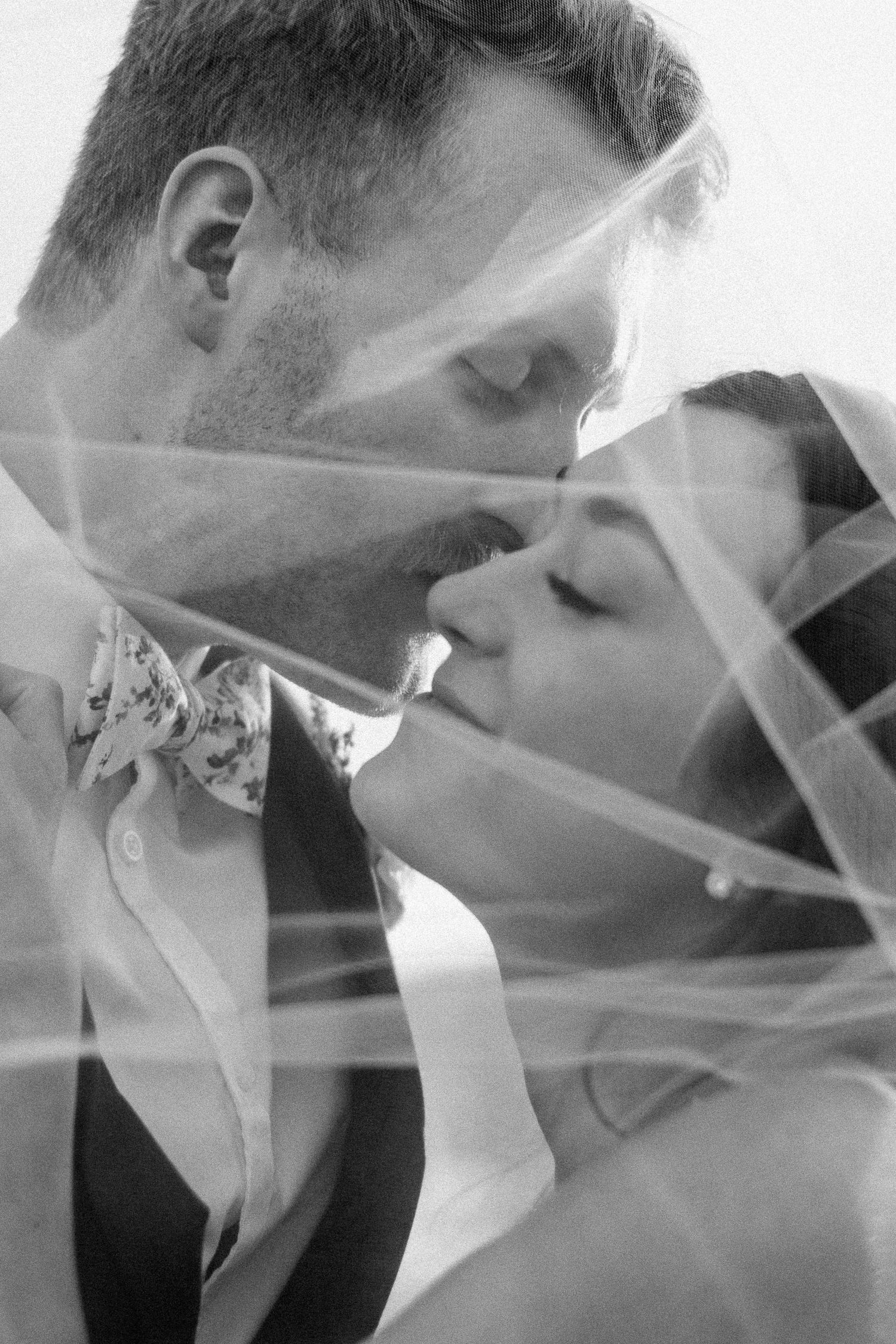 Artistic black and white wedding photography montage showing intimate moments.