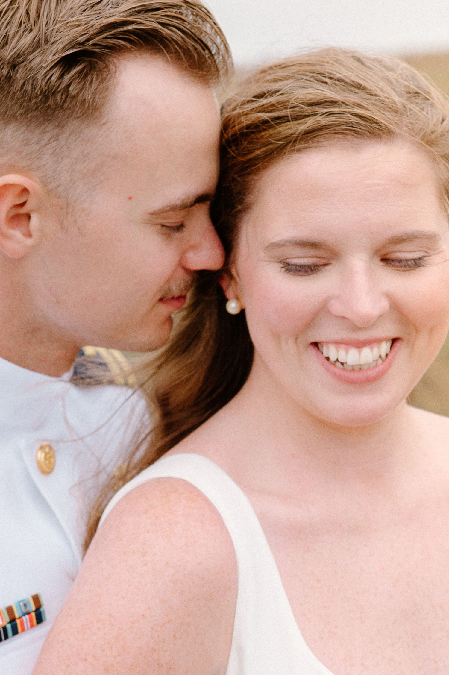 Intimate close-up portrait series showing joyful expressions and gentle moments.