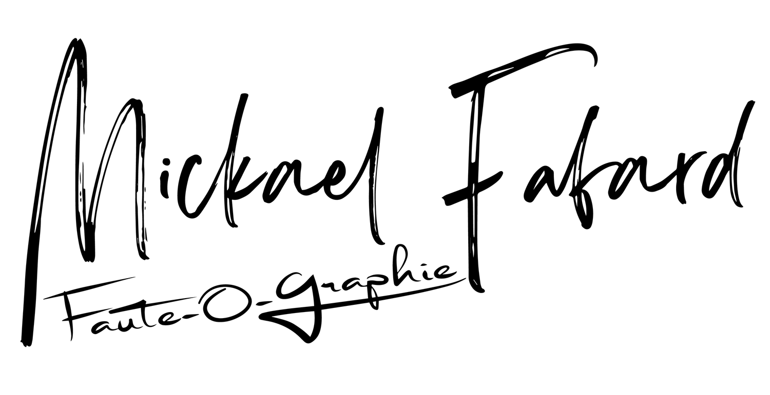 Handwritten signature style text in black ink.
