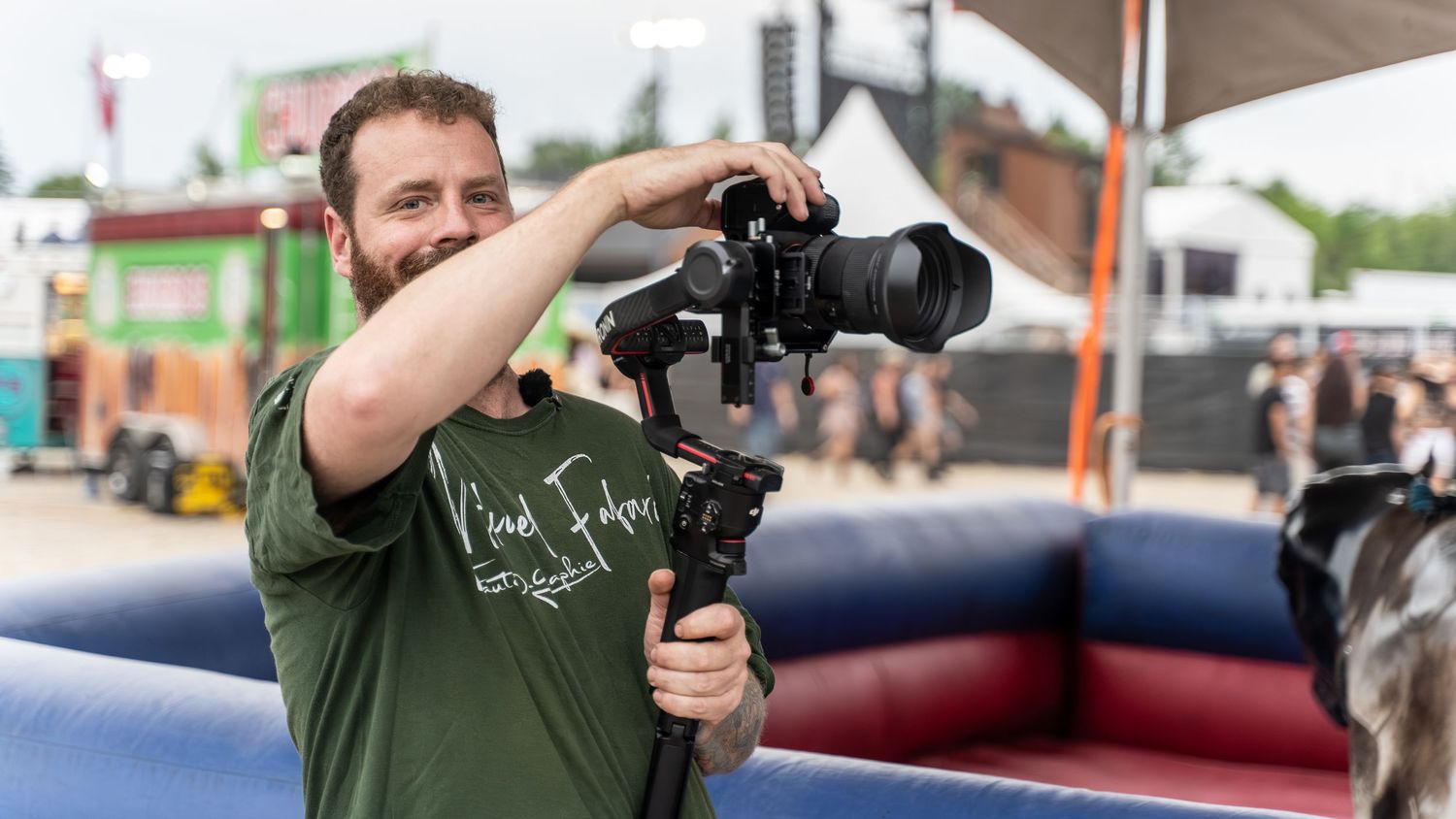 Photographers with professional cameras shooting on an outdoor set.