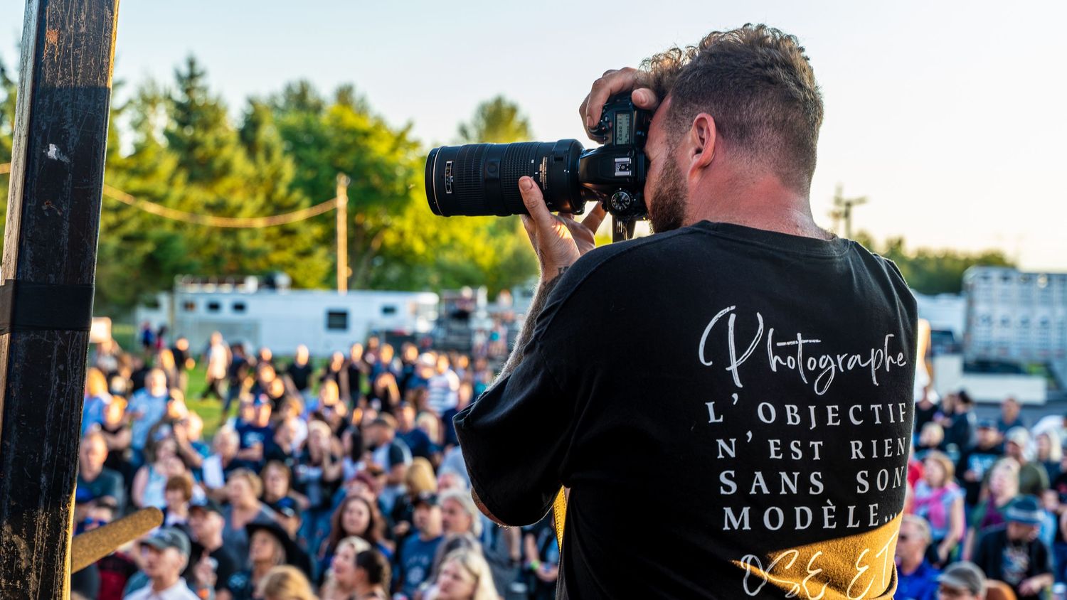 Outdoor photography equipment and gear set up at large public event.