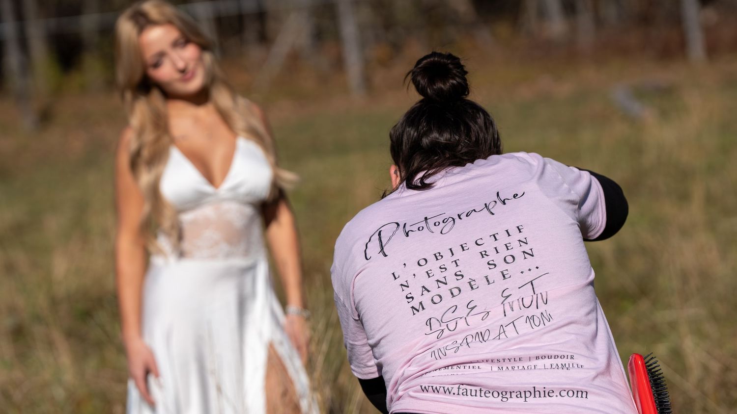Professional photography equipment and accessories against an outdoor natural backdrop.