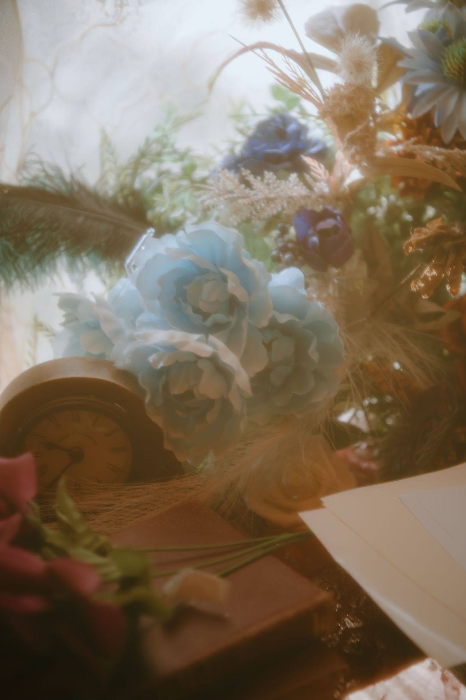 Dreamy close-up of blue roses and delicate floral arrangements with soft focus effects.