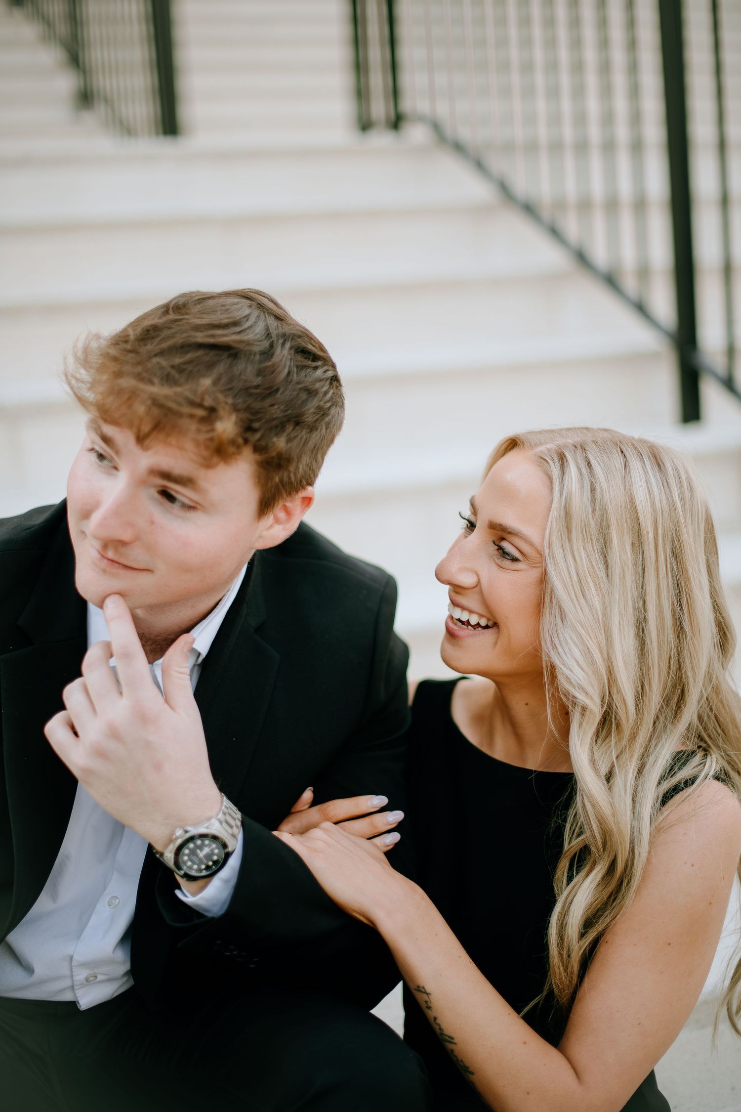 A couple shares playful and intimate moments together in a series of candid photographs.