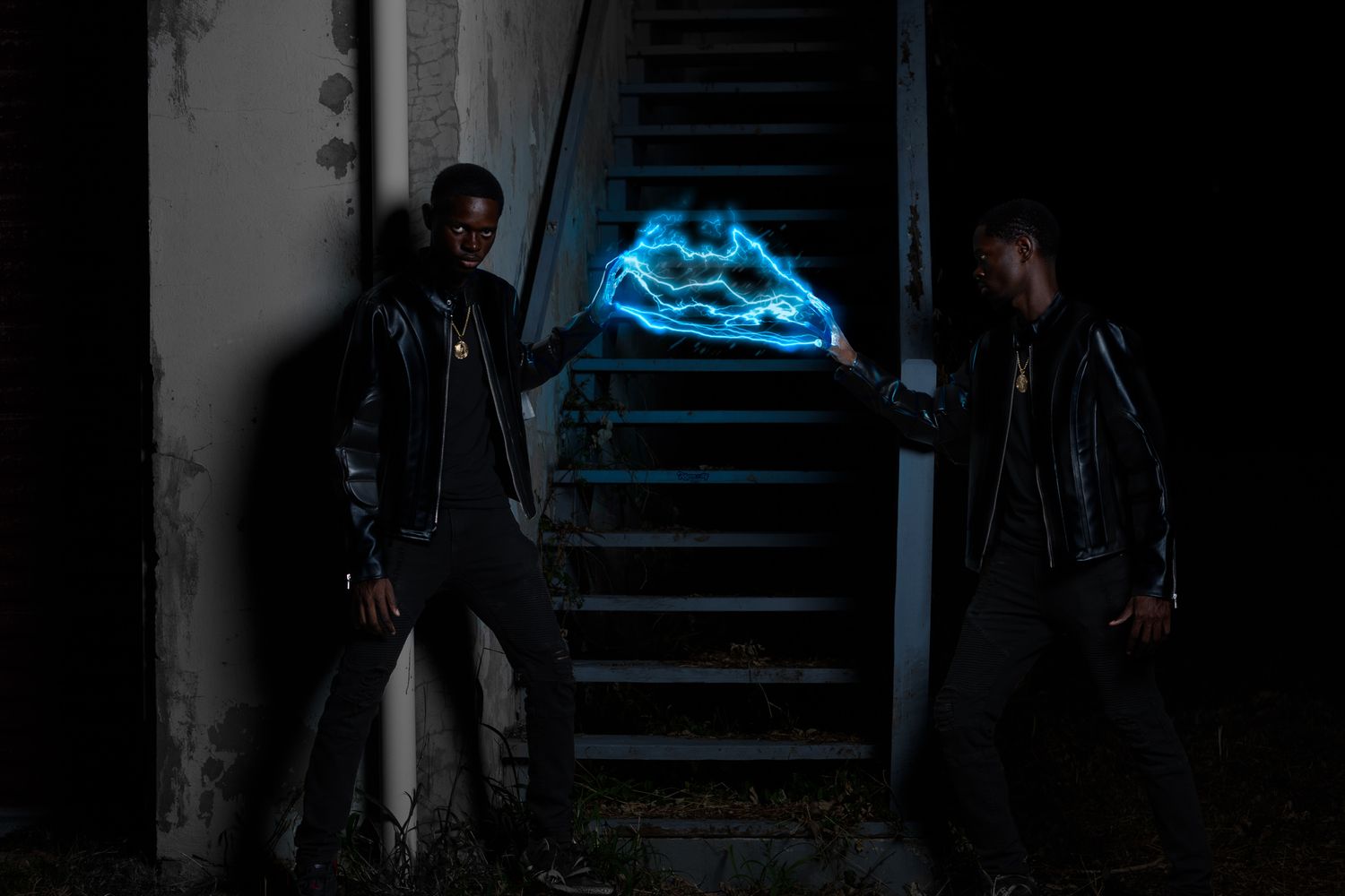 Dramatic low-light photo in stairwell with blue accent lighting.