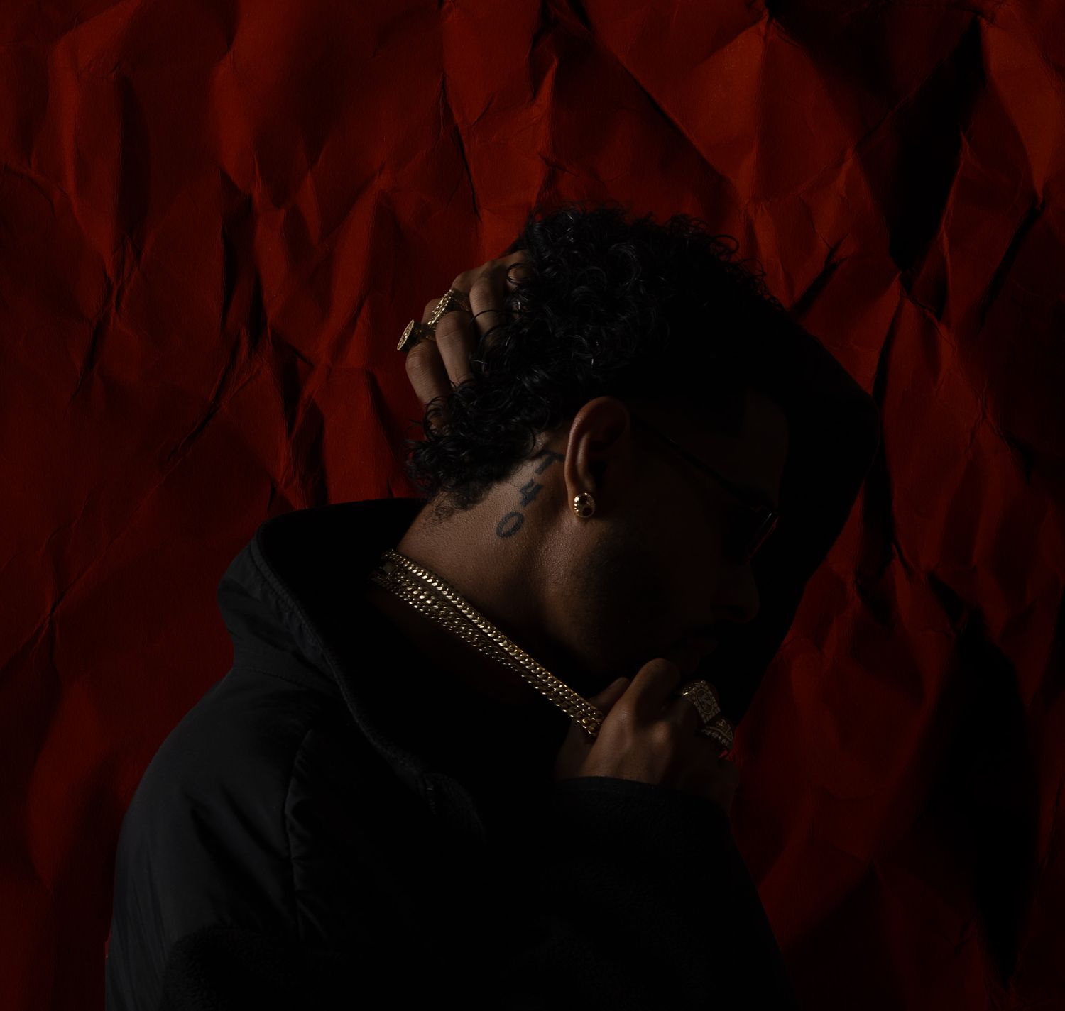 Dramatic portrait series with moody red lighting and dark shadows creating an artistic atmosphere.