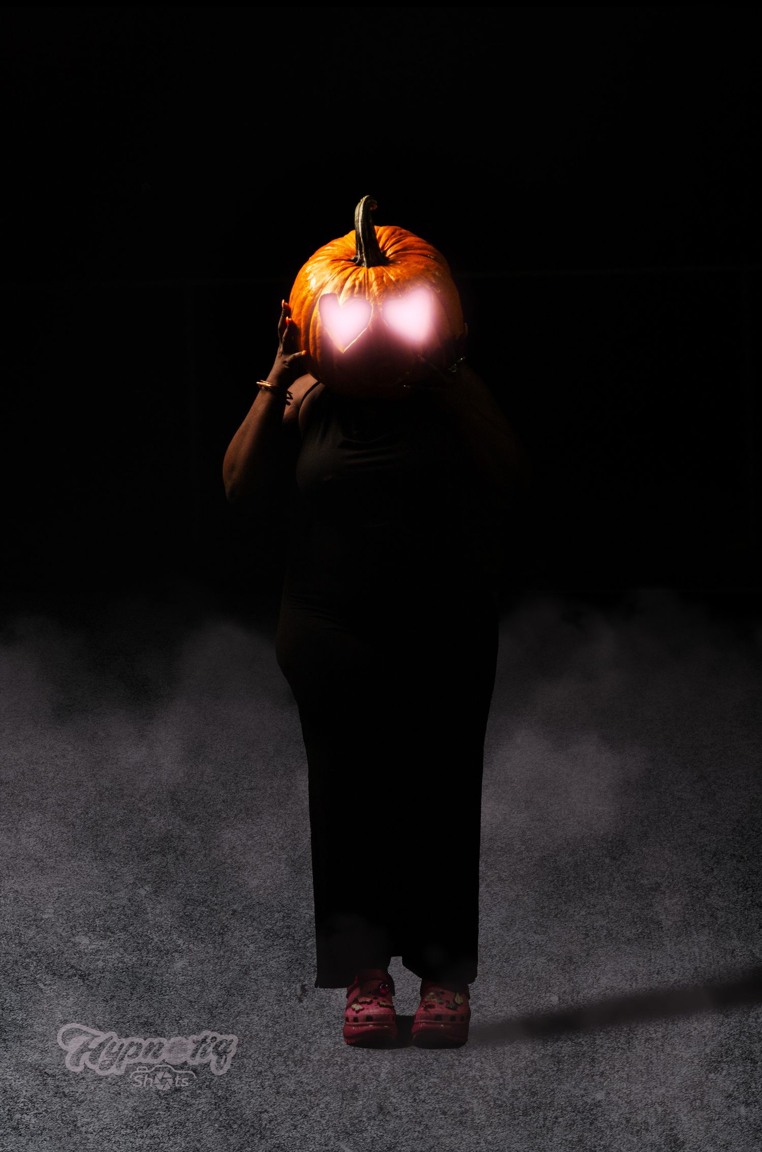 Dark moody photo series featuring a pumpkin and red shoes.