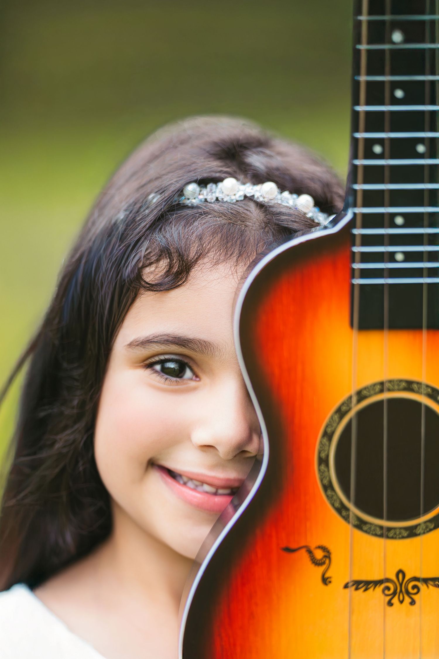 Children portrait with a guitar, natural light photography.