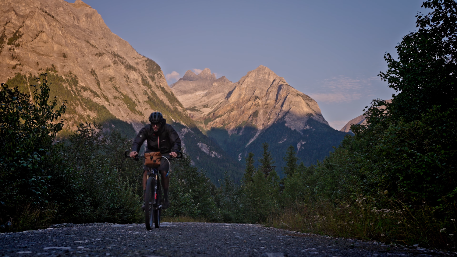 A series of panoramic mountain landscapes showing hikers on trails through rugged alpine terrain at sunset.