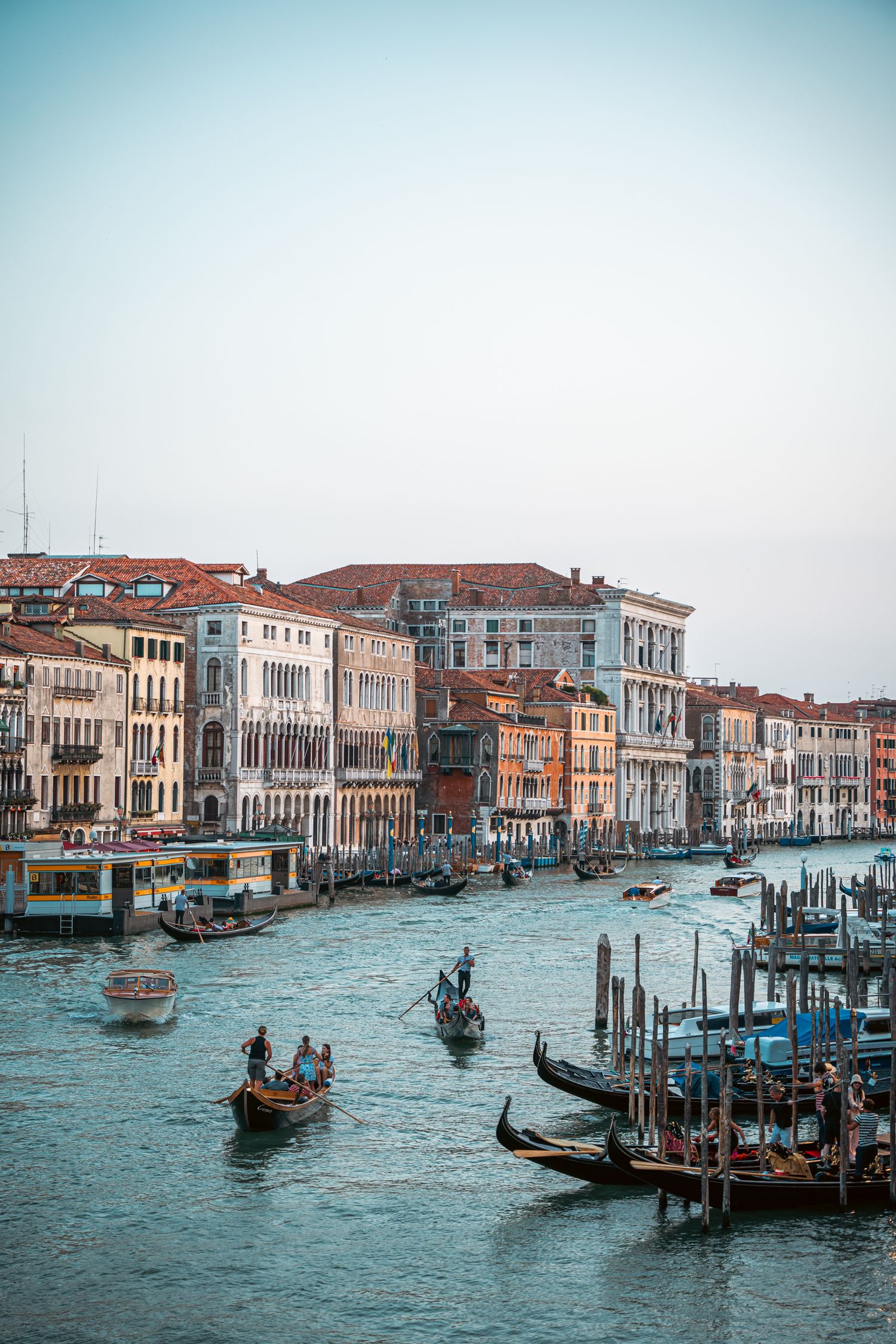 Scenic view of Venice's Grand Canal with traditional gondolas and historic buildings along the waterfront.