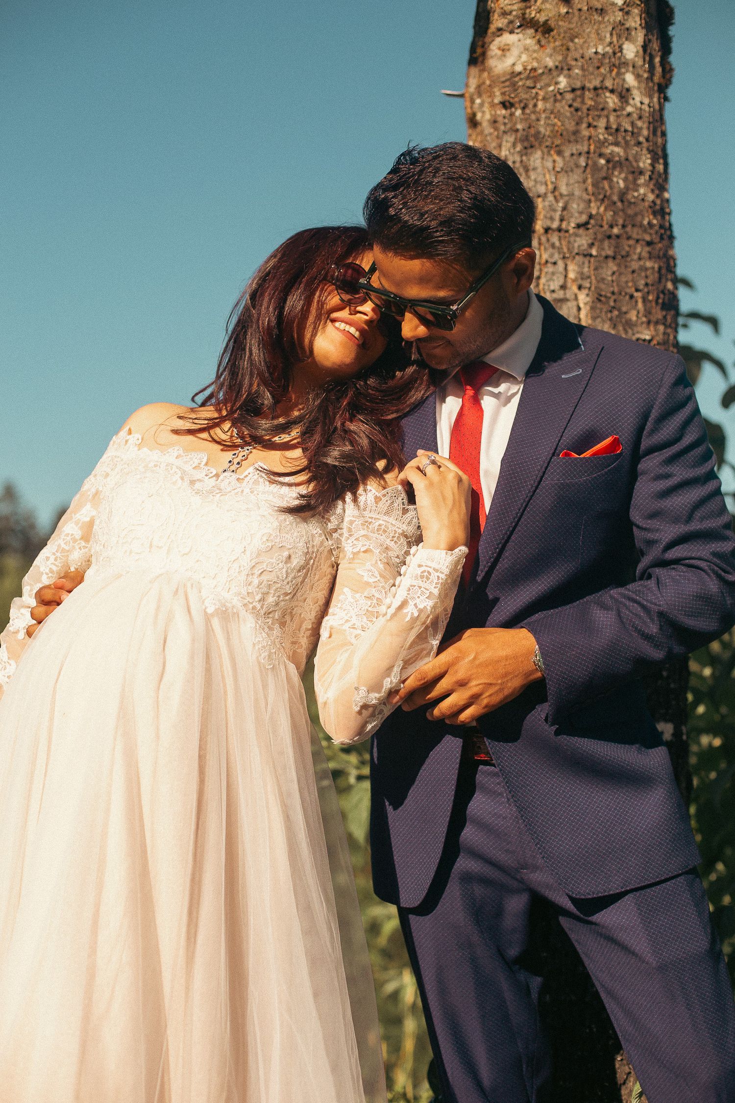 A woman leans against her husband while posing for baby shower photos in Southeast Portland, Oregon.