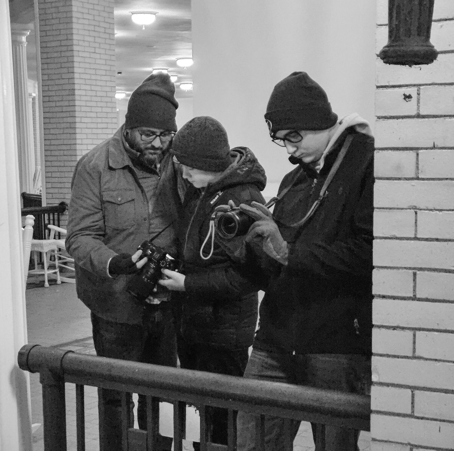 Torrey Hanke, co owner of Hanke Studios, teaching his sons how to use a camera.