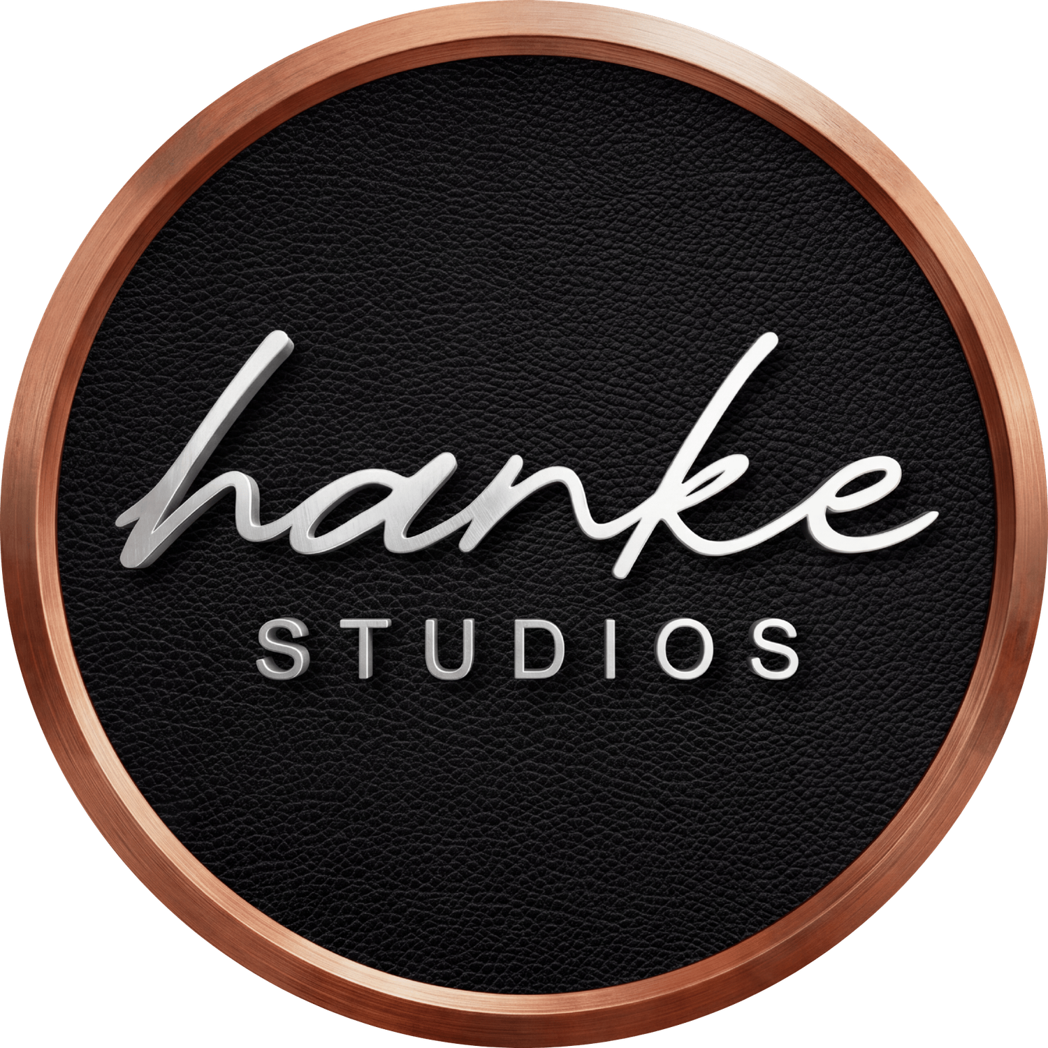 Hanke Studios logo featuring elegant script lettering on a dark leather-textured circular badge with a rose gold border.