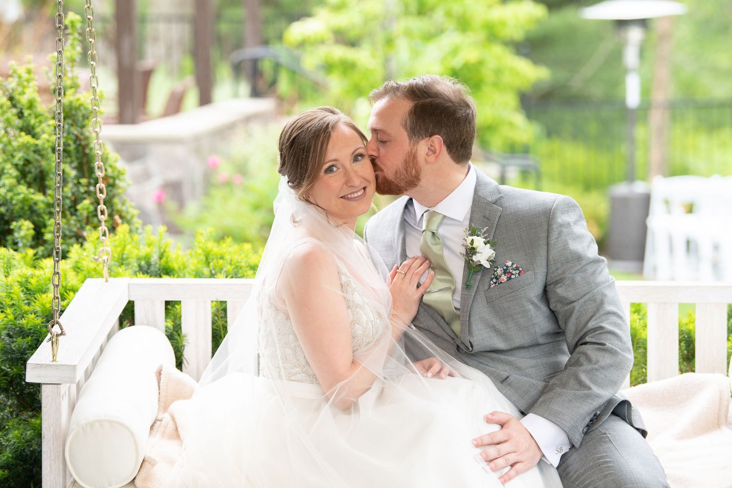A romantic wedding couple shares tender kisses and embraces in a garden setting across multiple photos.