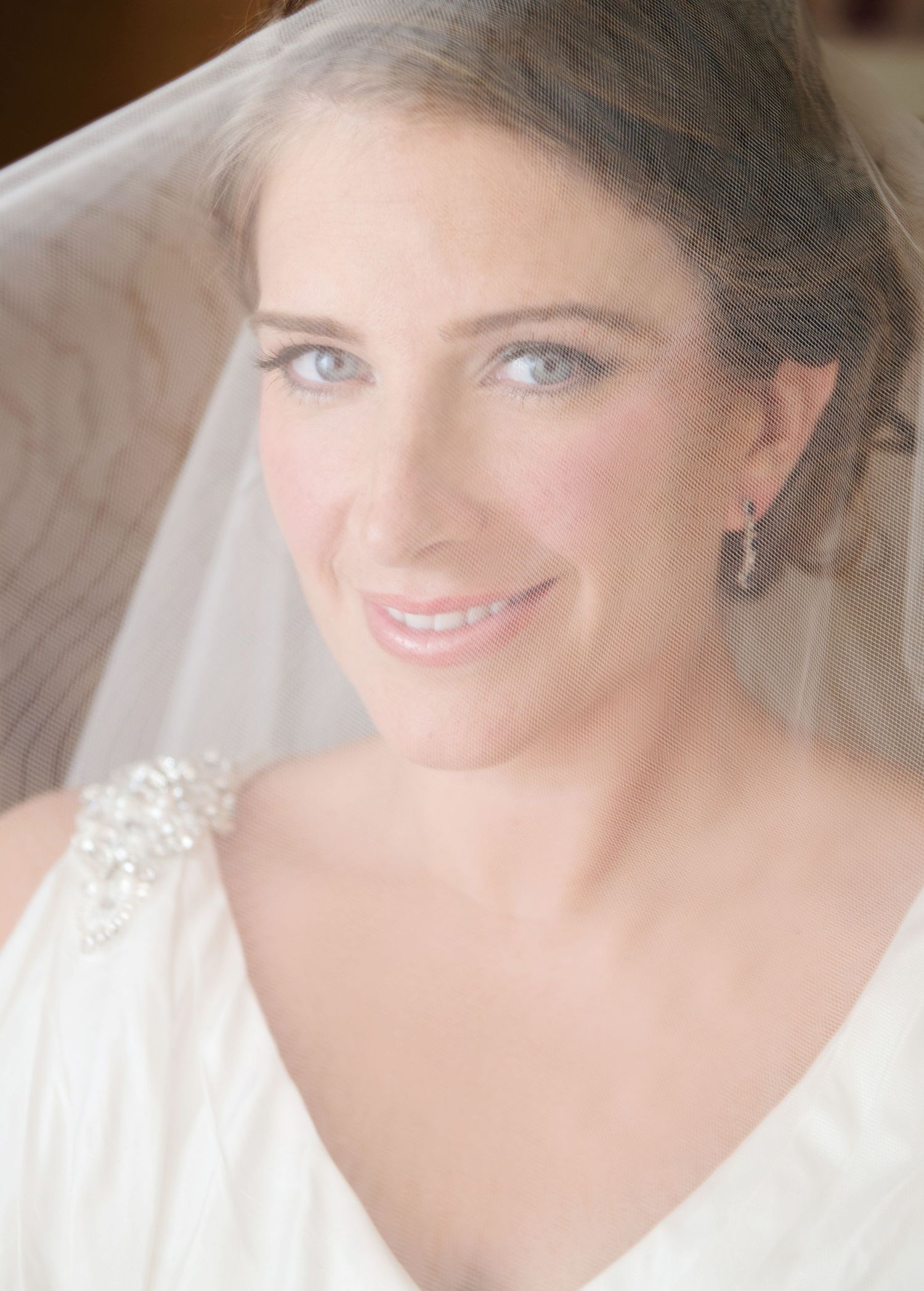 A soft focused bridal portrait series shows a glowing smile in ethereal bright lighting.