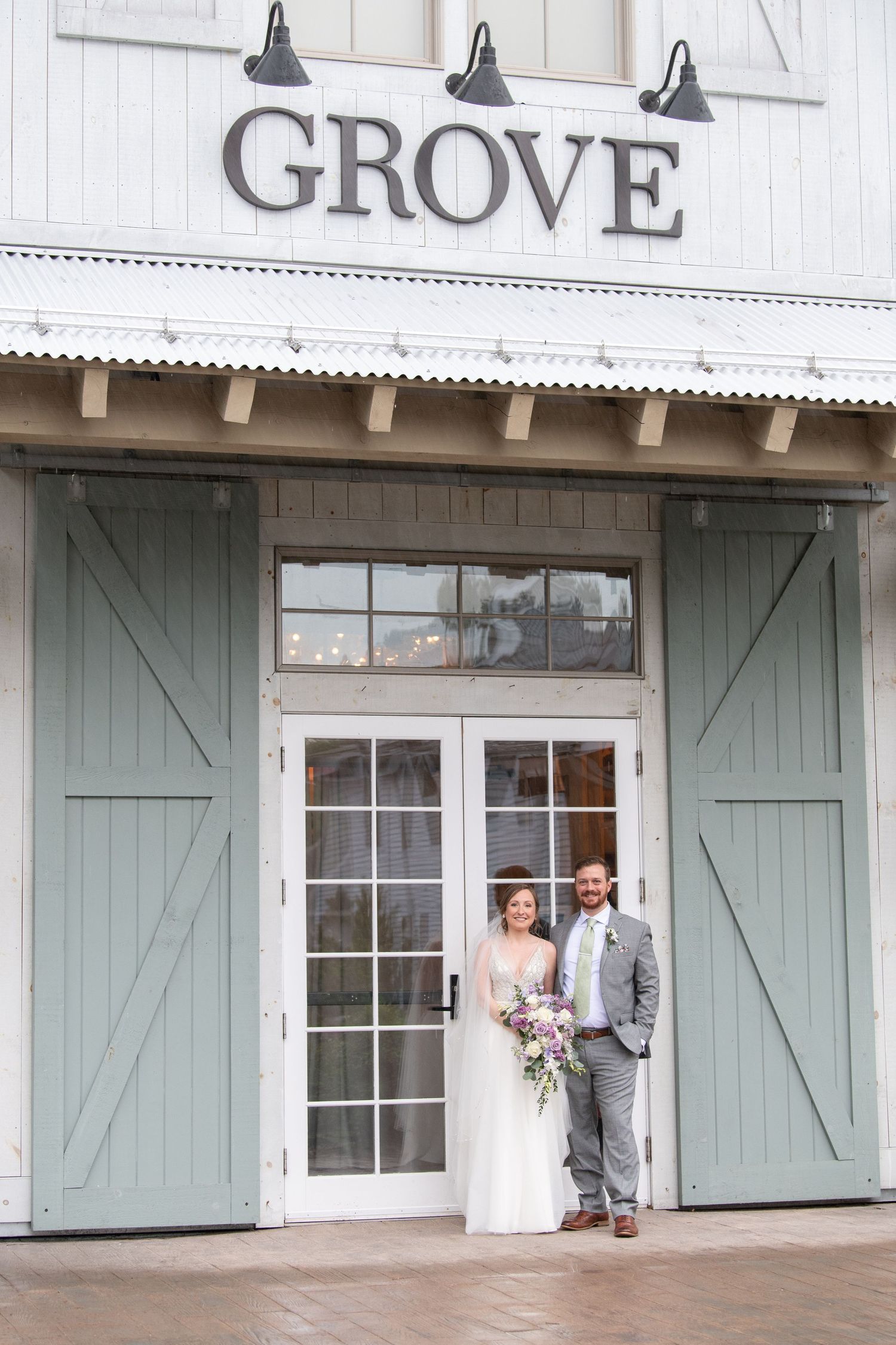 A series of wedding photos showing a couple outside a rustic venue with sage green shutters and white exterior.