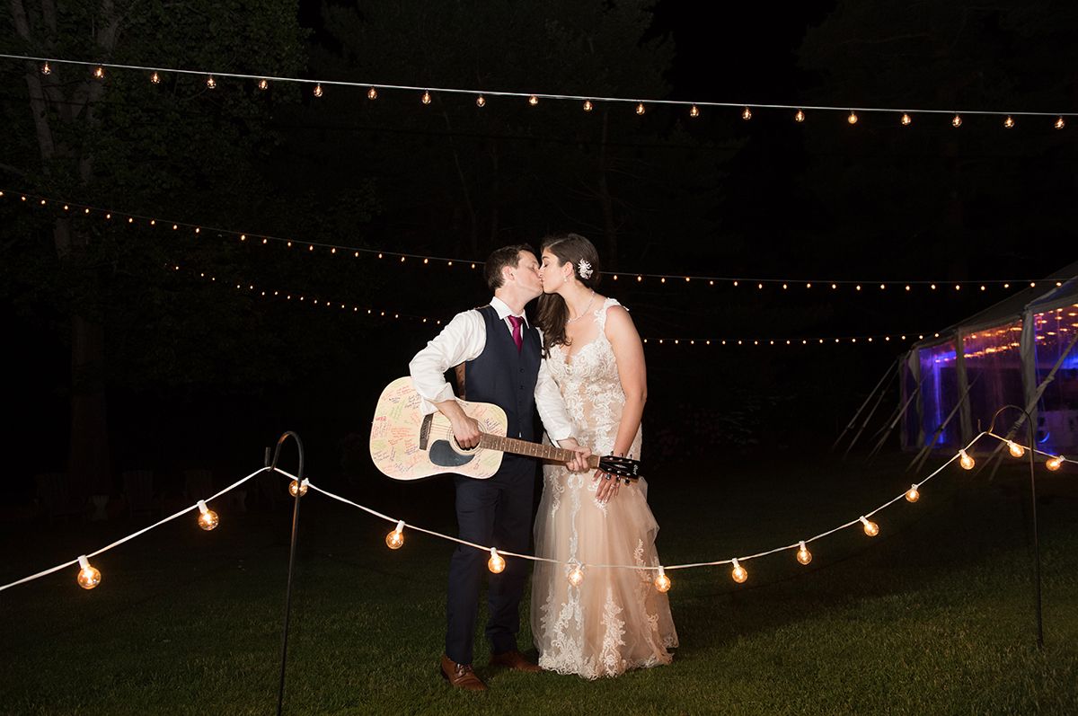 Wedding string lights illuminate figures dancing in a series of nighttime outdoor celebration photos.