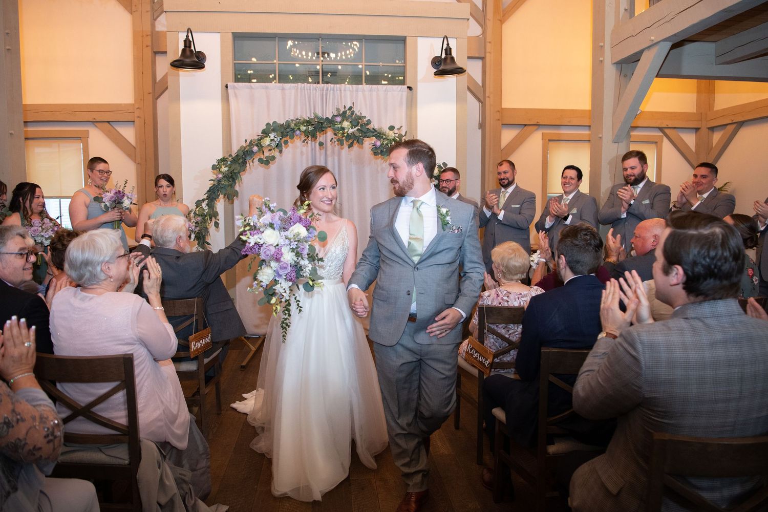 Wedding reception venue decorated with warm lighting and floral arrangements for an intimate celebration.