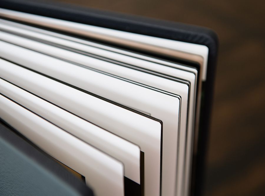 Close-up view of white pages in a book showing crisp edges and layered paper texture.