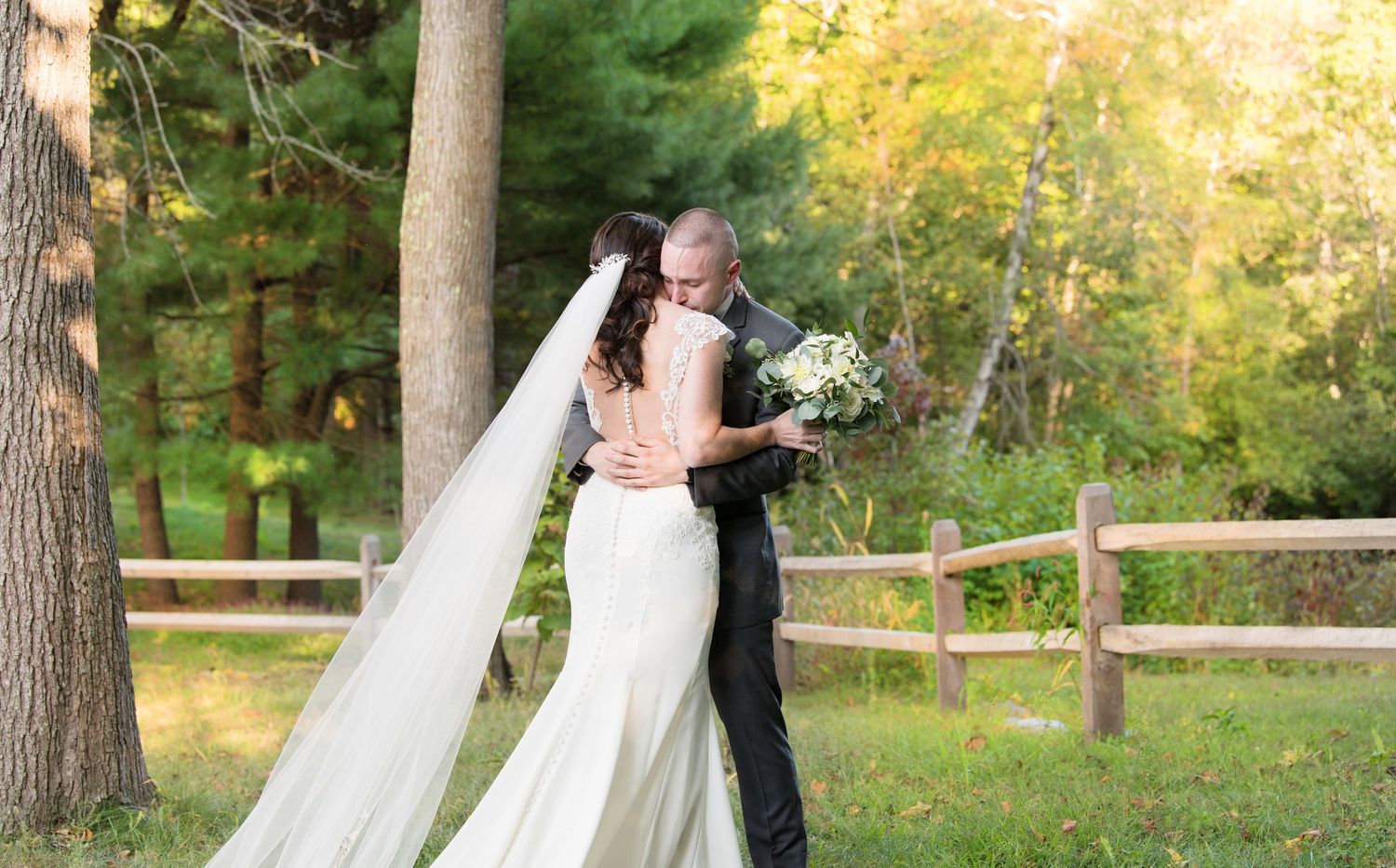 A romantic sunset portrait of newlyweds embracing in a natural outdoor setting. Grove Rowley wedding