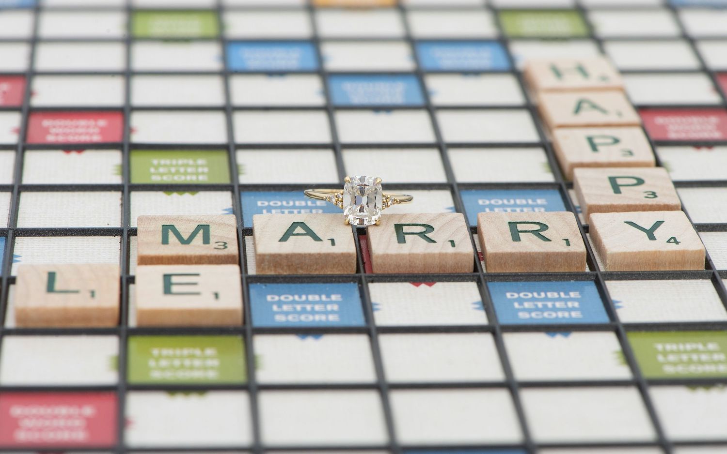 Top-down view of a traditional board game with colorful squares and text labels on a white background.