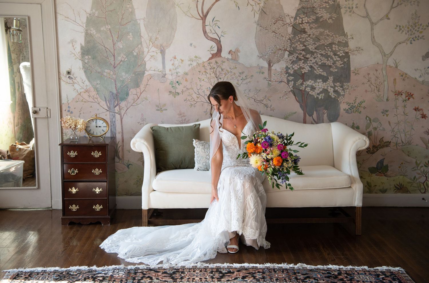 Elegant wedding photos in a luxurious indoor setting with floral wallpaper and antique furniture. Long Hill wedding