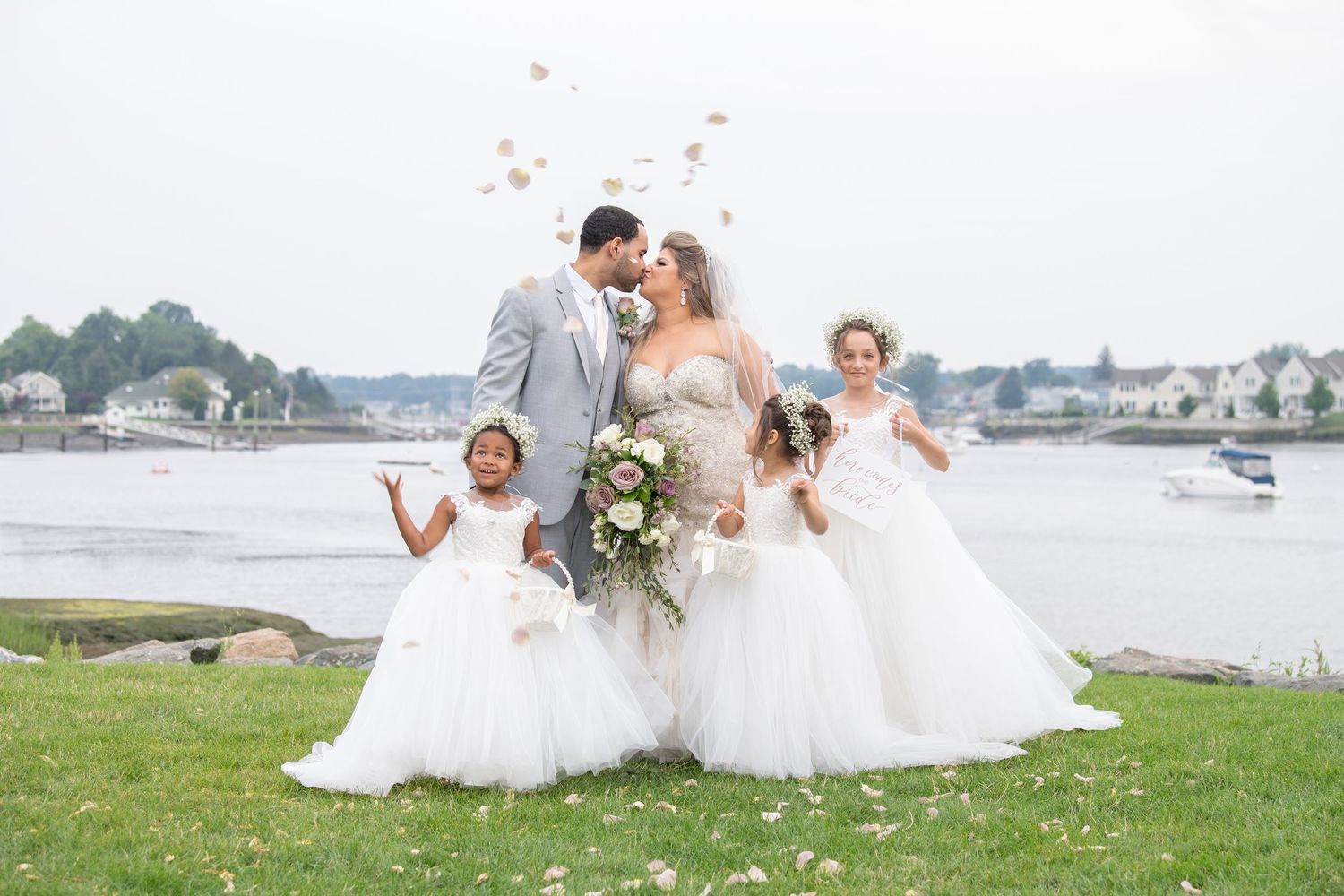 A collage of wedding photographs showing couples and groups posing by the waterfront on a cloudy day.